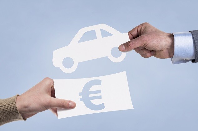 Hands taking paper icons of money and car. Leasing concept.